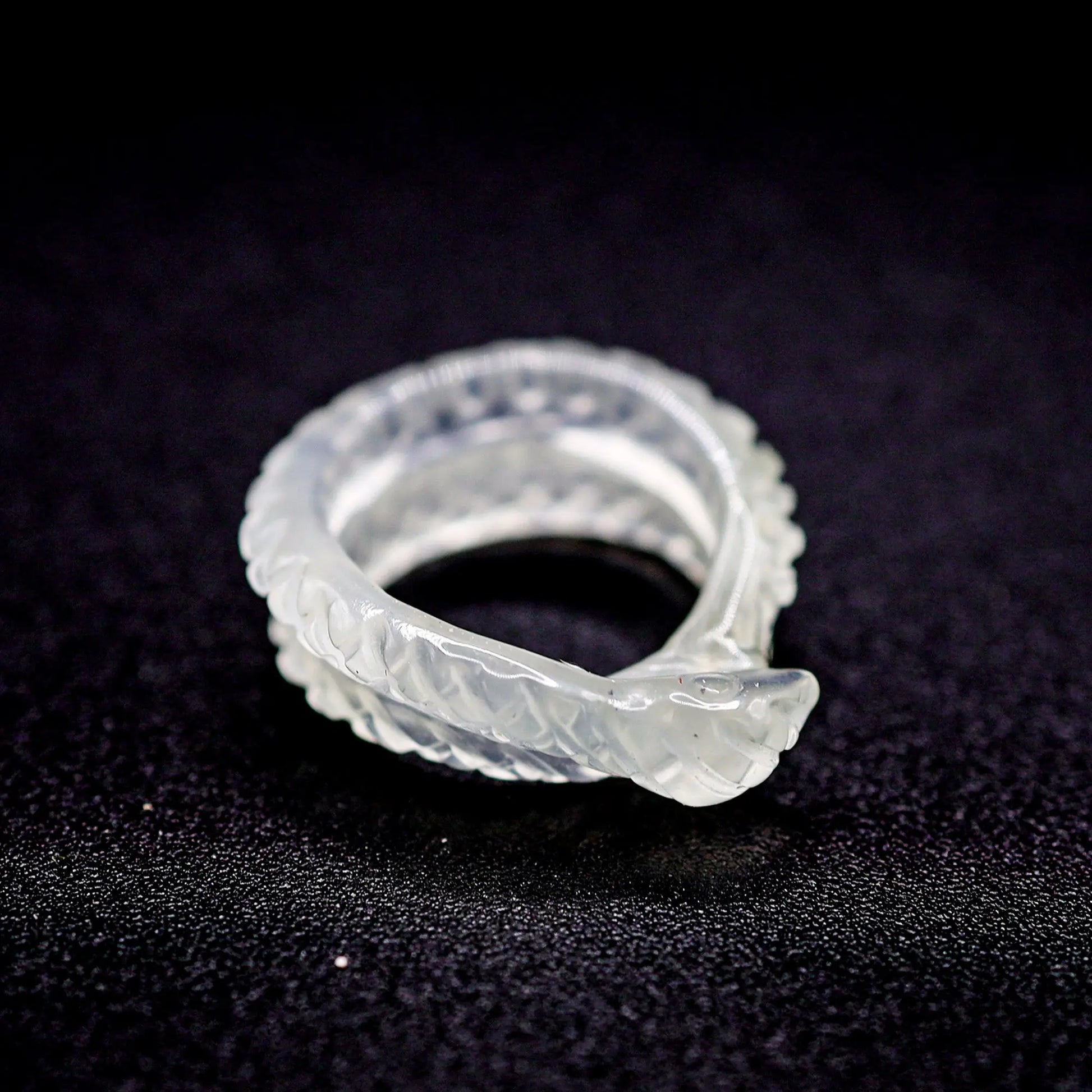 Handcrafted Ethereal Serpent Ring featuring an icy white serpentine base with a delicately carved snake wrapping around the finger, symbolizing wisdom and rebirth. The exquisite detailing and three-dimensional snake design make this ring a unique piece of enchanting, mythical-inspired jewelry, perfect for adding a touch of mystical elegance to any outfit.