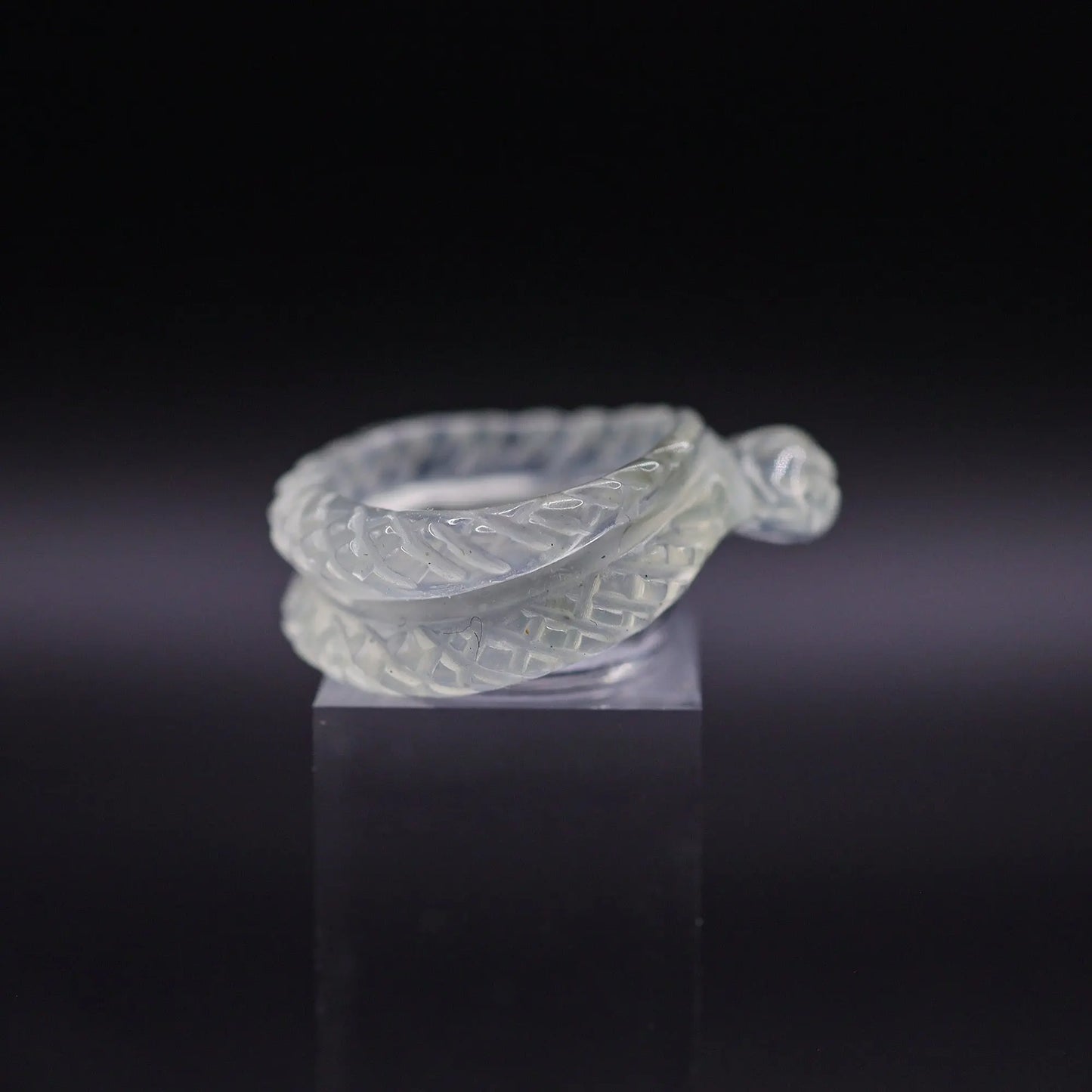 Handcrafted Ethereal Serpent Ring featuring an icy white serpentine base with a delicately carved snake wrapping around the finger, symbolizing wisdom and rebirth. The exquisite detailing and three-dimensional snake design make this ring a unique piece of enchanting, mythical-inspired jewelry, perfect for adding a touch of mystical elegance to any outfit.