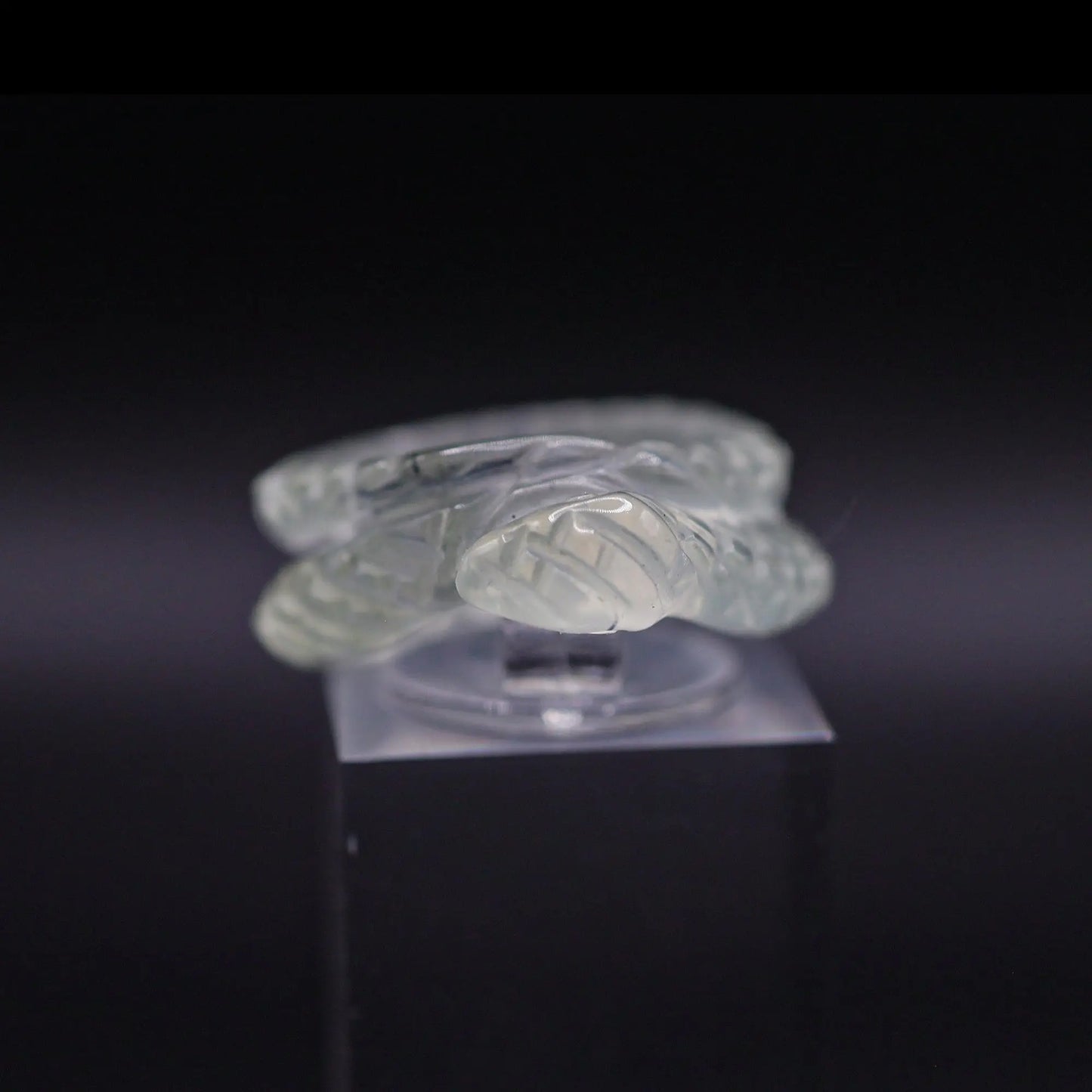 Handcrafted Ethereal Serpent Ring featuring an icy white serpentine base with a delicately carved snake wrapping around the finger, symbolizing wisdom and rebirth. The exquisite detailing and three-dimensional snake design make this ring a unique piece of enchanting, mythical-inspired jewelry, perfect for adding a touch of mystical elegance to any outfit.