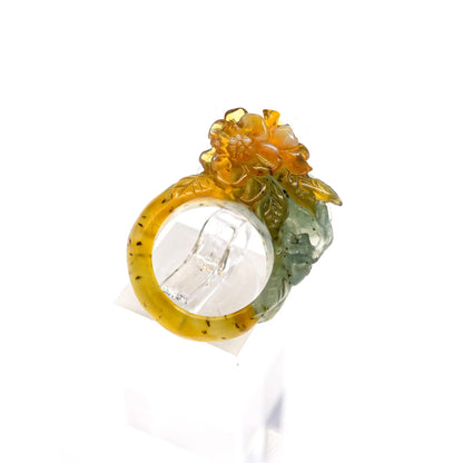 Exquisite Tri-Color Blossom Serpentine Ring featuring a unique blend of blue-green, yellow, and white hues intricately carved into floral and leaf designs, symbolizing growth and renewal. This handmade, nature-inspired ring showcases artisan craftsmanship and is hypoallergenic, ideal for sensitive skin.
