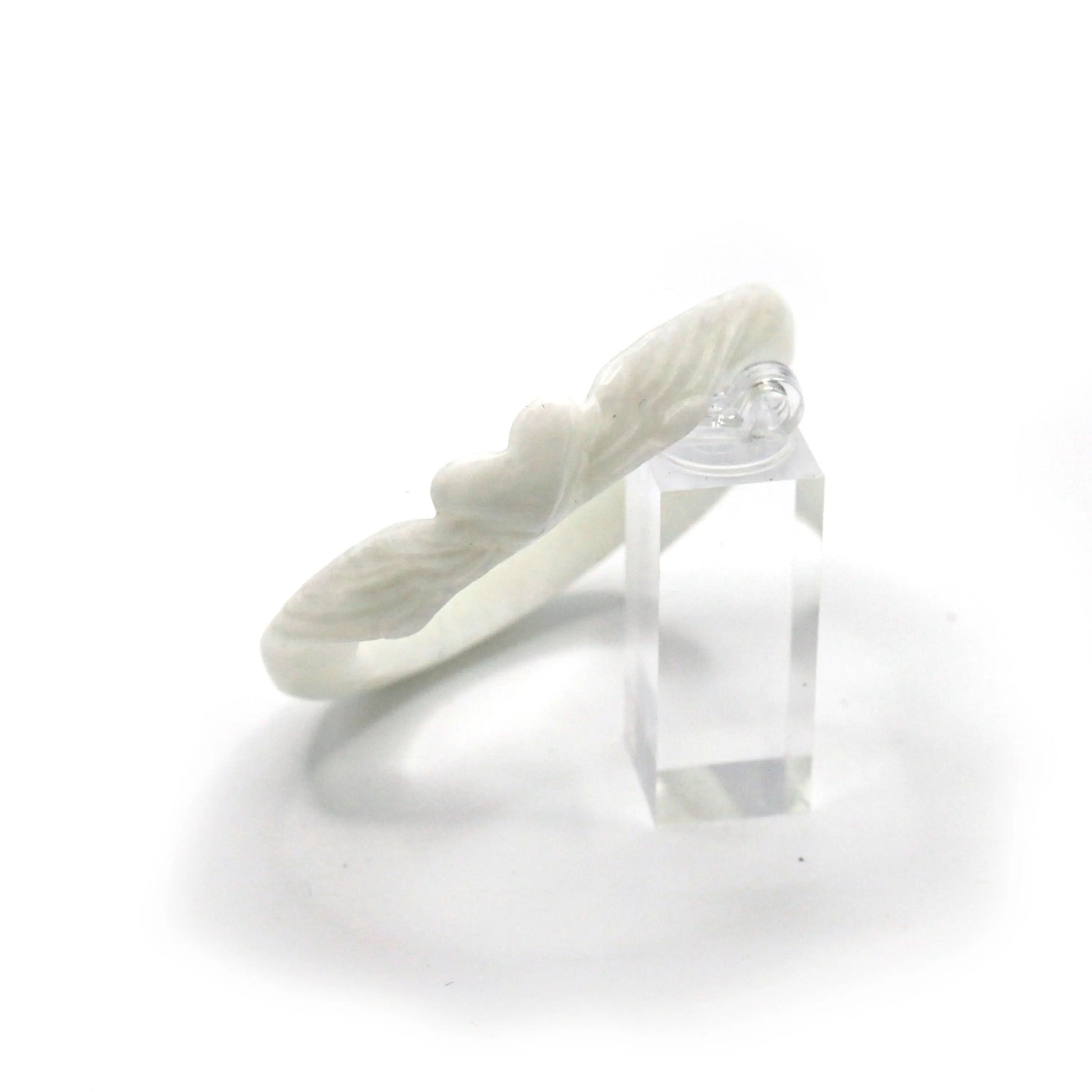 Jade bangle in a milky white tone with hand-carved feather shapes and a center heart, offering elegance with gentle meaning – Miruzi