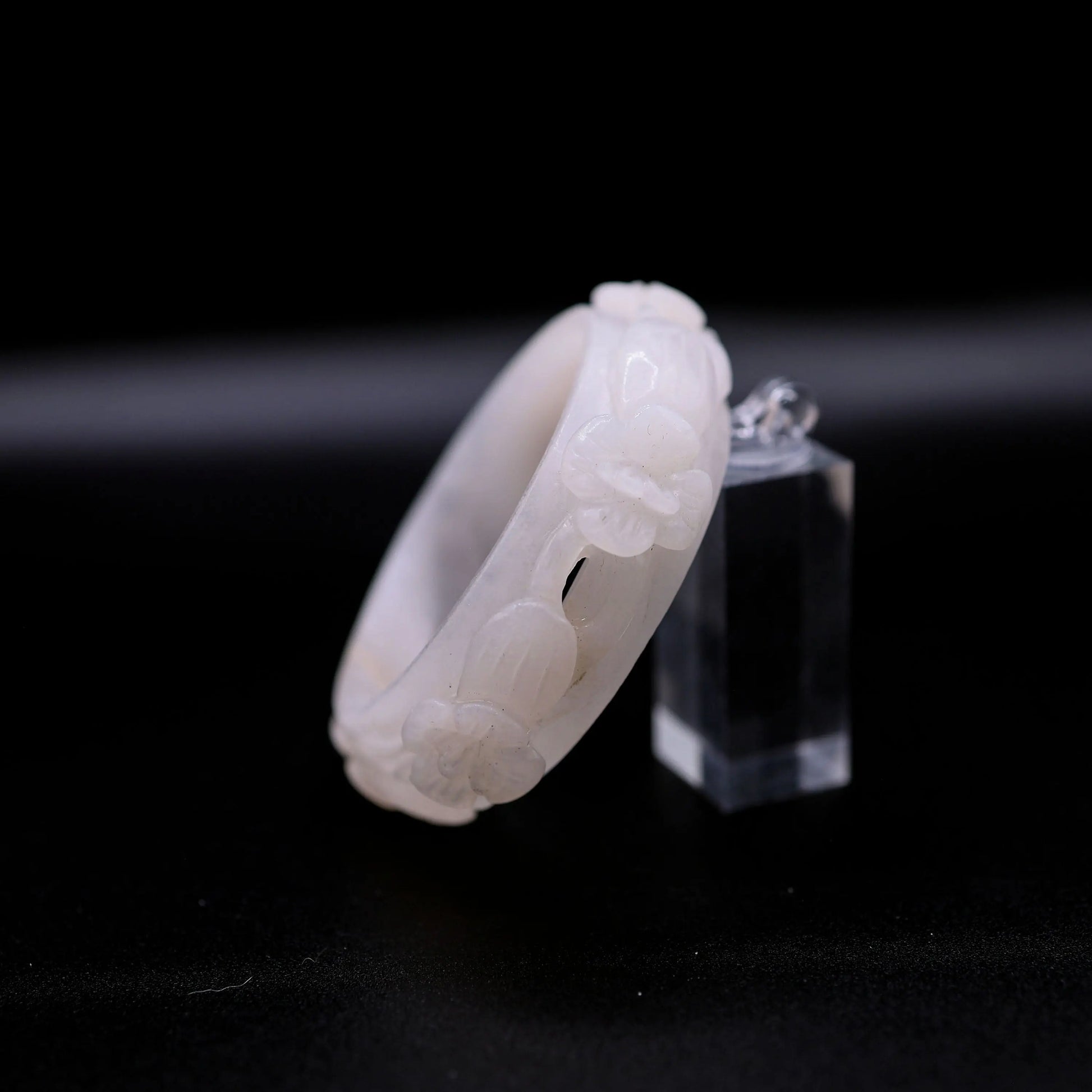 Softly polished white quartzite jade bracelet with full-relief violet blossoms cut into the surface, evoking poetic grace – Miruzi