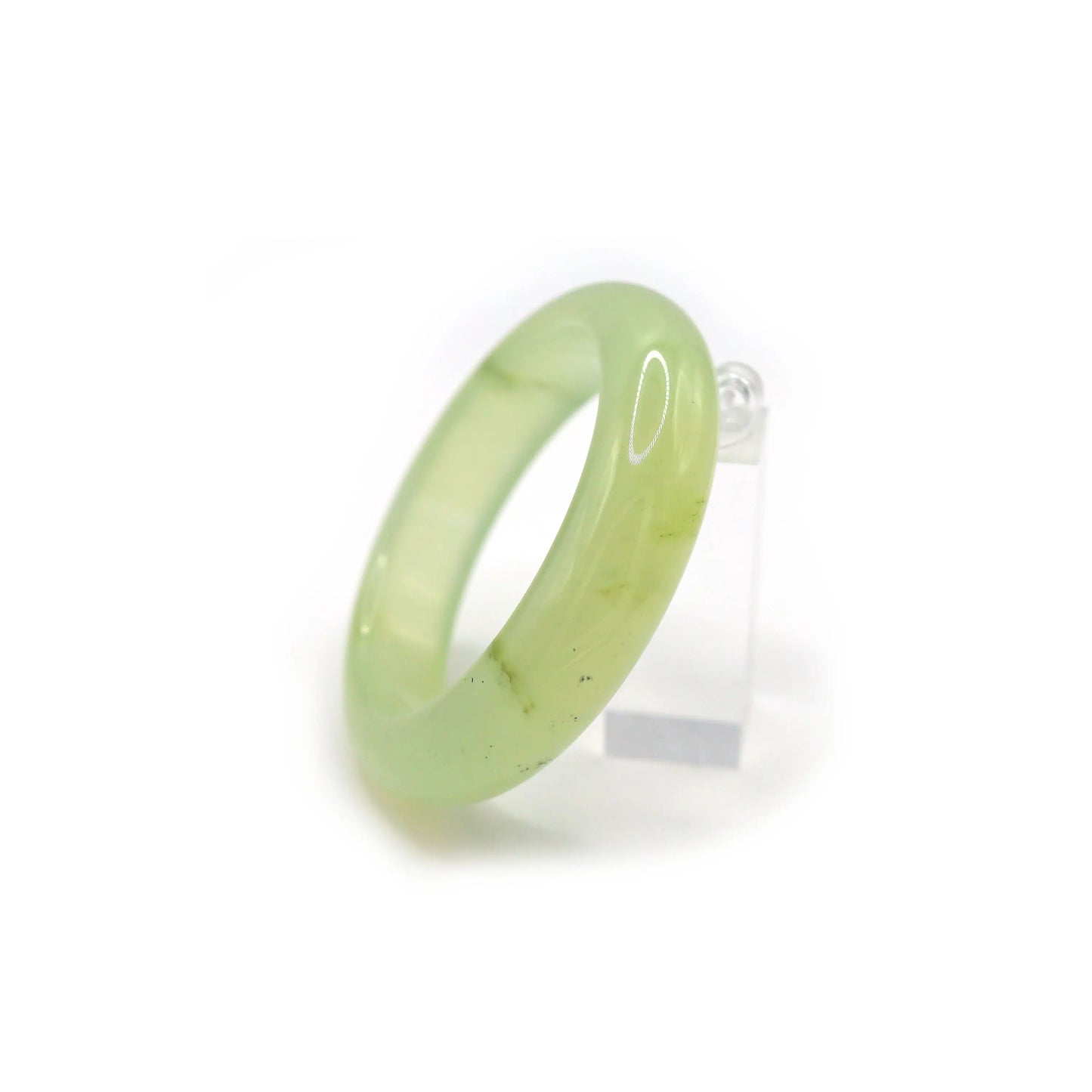 Close-up of crystal-clear jade bracelet showing flawless surface and delicate green hue, like frozen morning dew – Miruzi

