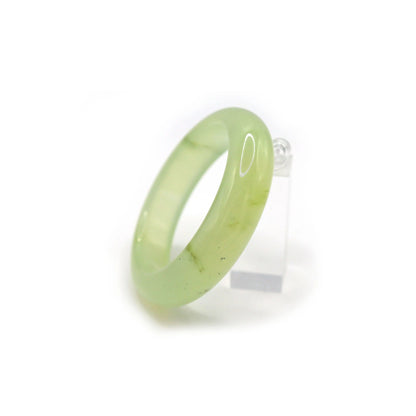 Close-up of crystal-clear jade bracelet showing flawless surface and delicate green hue, like frozen morning dew – Miruzi

