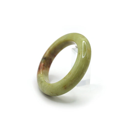 Sunlit jade bracelet glowing with semi-translucent green and warm yellow hues Miruzi