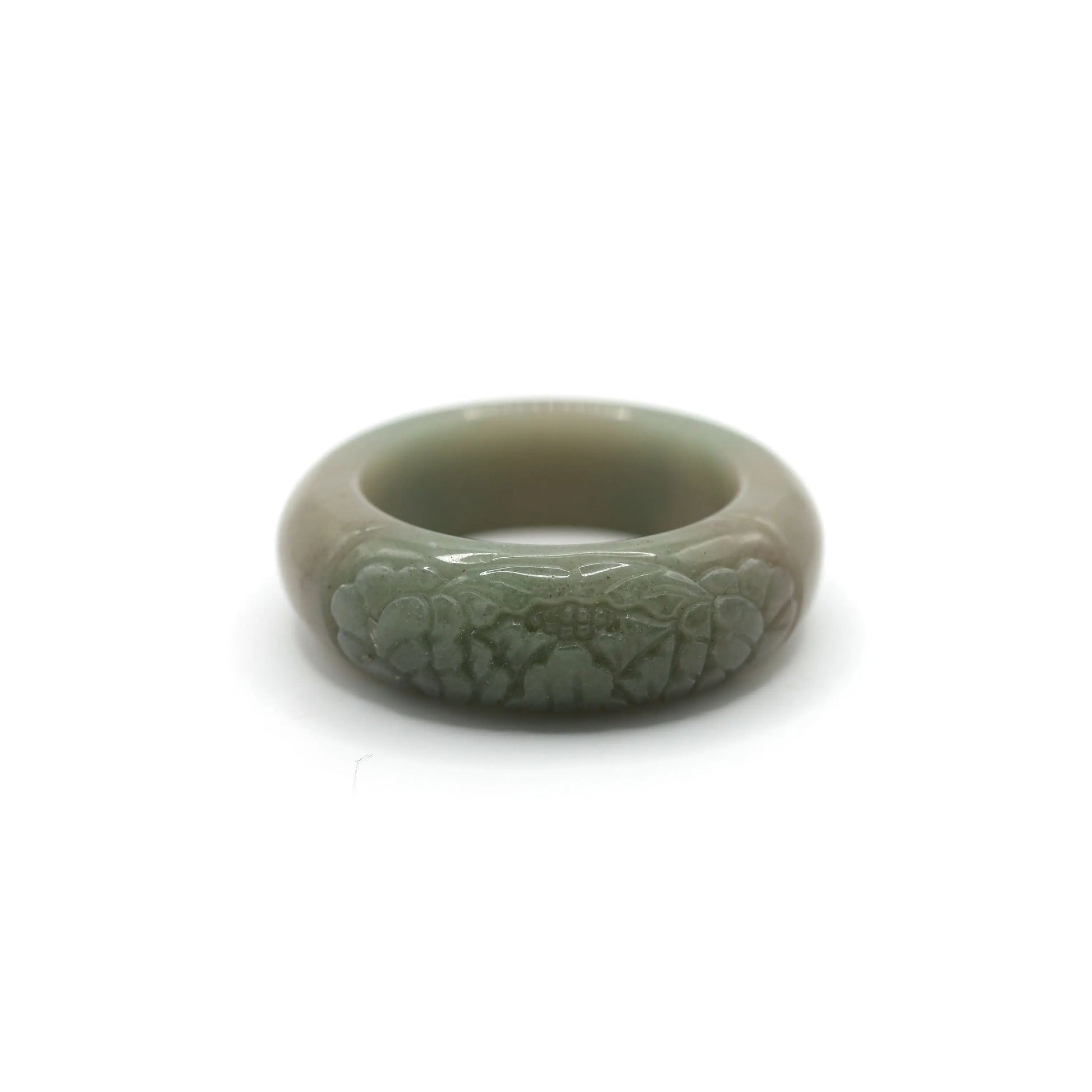 Soft green Mongolian jade bracelet with a single sculpted peony flower on one side, blending asymmetry with organic elegance – Miruzi