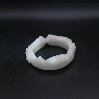 Artisan-crafted white jade bangle with sculpted feline ears, tiny paw prints, and symbolic floral motifs for animal lovers – Miruzi