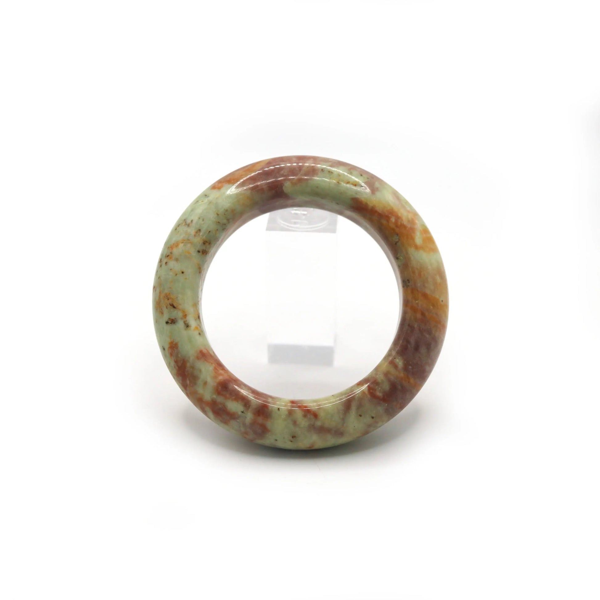 Side angle of jade bracelet showing transition from red to green mineral tones Miruzi