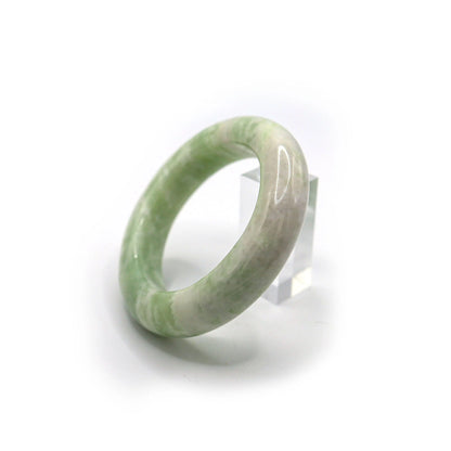 Side view of jade bracelet highlighting layered green and white veining Miruzi