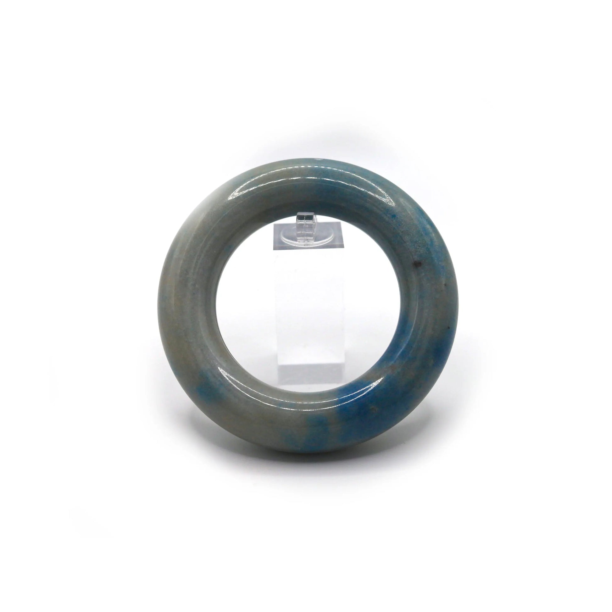 Donut-shaped jade bracelet showing subtle motion through mineral veins, like light skies captured in natural stone – Miruzi