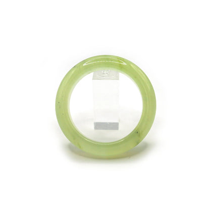 Translucent pale green jade bangle displayed on a clean white background, emphasizing its weightless and pure design – Miruzi