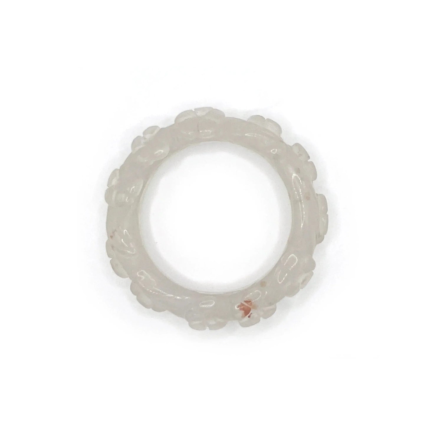 Artisan hand-carved lotus flower bracelet crafted from blush pink Mongolian jade, showcasing delicate lotus motifs and expert craftsmanship in every detail.