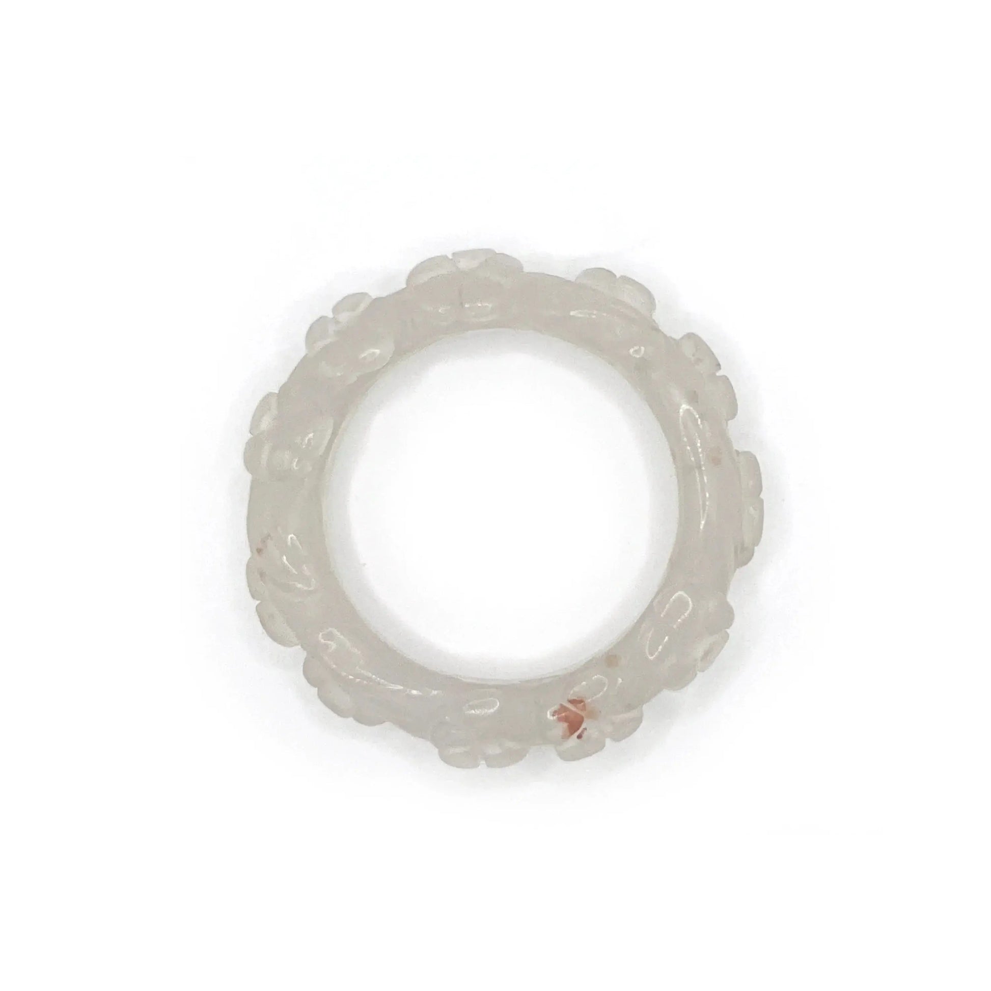 Artisan hand-carved lotus flower bracelet crafted from blush pink Mongolian jade, showcasing delicate lotus motifs and expert craftsmanship in every detail.