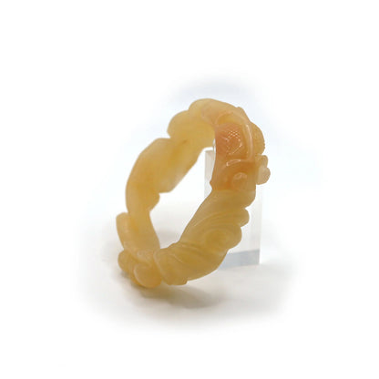 Smooth yellow jade bracelet with carved lotus flowers and a goldfish, blending harmony and elegance in fine natural quartzite – Miruzi