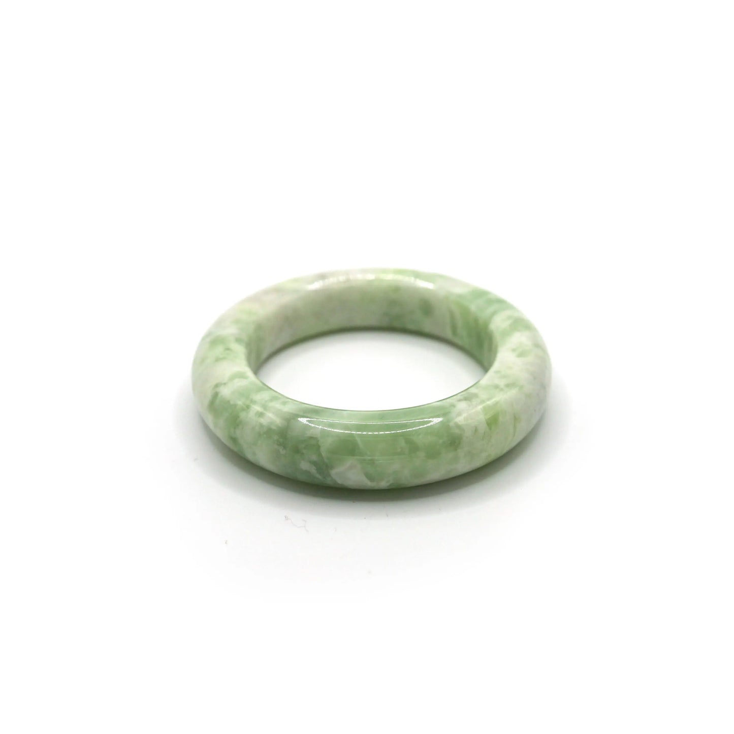 Matcha green jade bracelet with creamy white marbling on soft neutral fabric -Miruzi