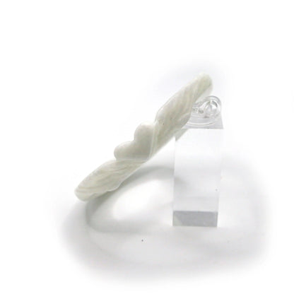 Elegant white jade bracelet with subtle heart and feather patterns engraved along its surface, styled for a soft, poetic look – Miruzi