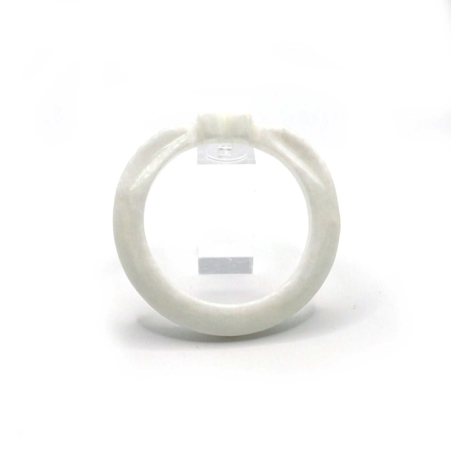 Thin white jade bracelet carved with a heart and wing-like feather designs, evoking purity and emotional symbolism – Miruzi