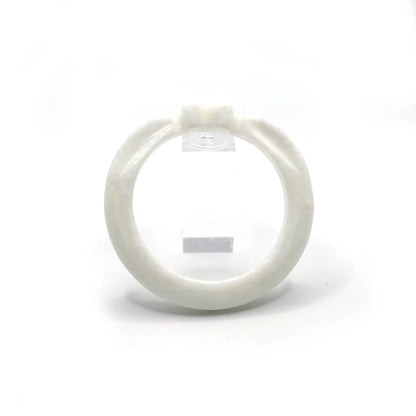 Thin white jade bracelet carved with a heart and wing-like feather designs, evoking purity and emotional symbolism – Miruzi