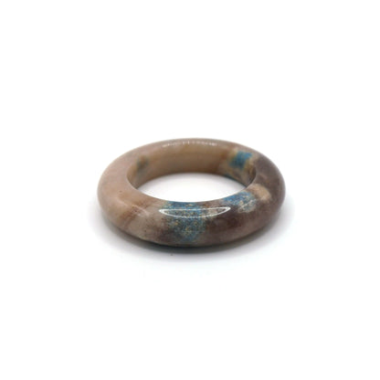 Mongolian quartzite jade bracelet in a donut design, featuring dreamy blue and lavender mineral clusters on a smooth white base – Miruzi