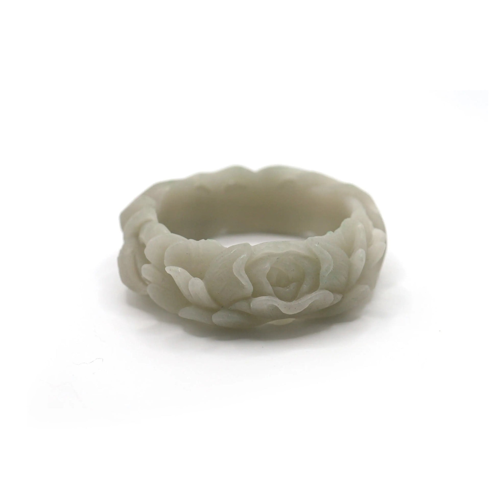 Artisan jade bracelet carved with a peaceful fox and full-bloom peony in pale green jade, representing intuition and compassion – Miruzi