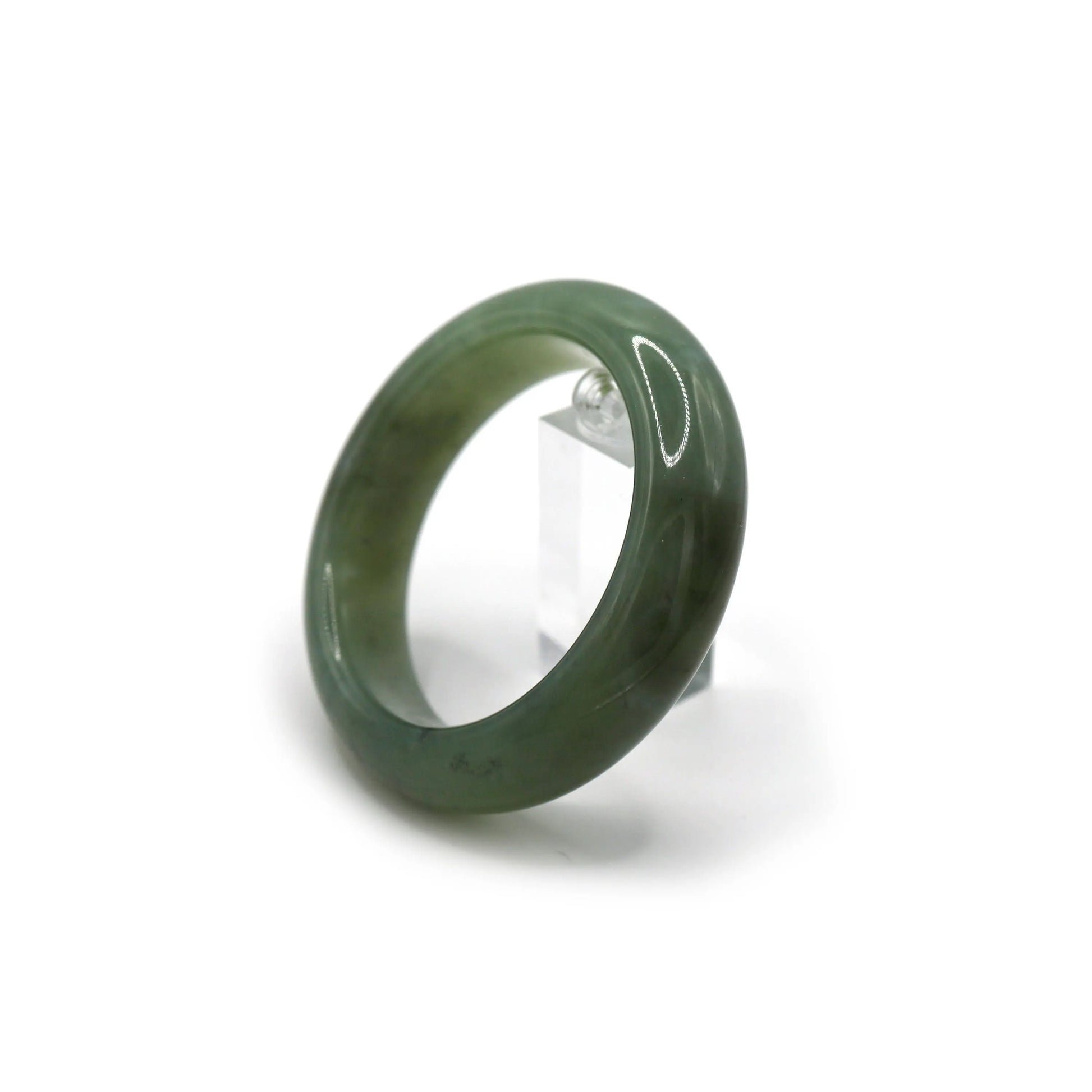 Jade bracelet beside soft-toned silk and dried leaves for calm visual styling - Miruzi