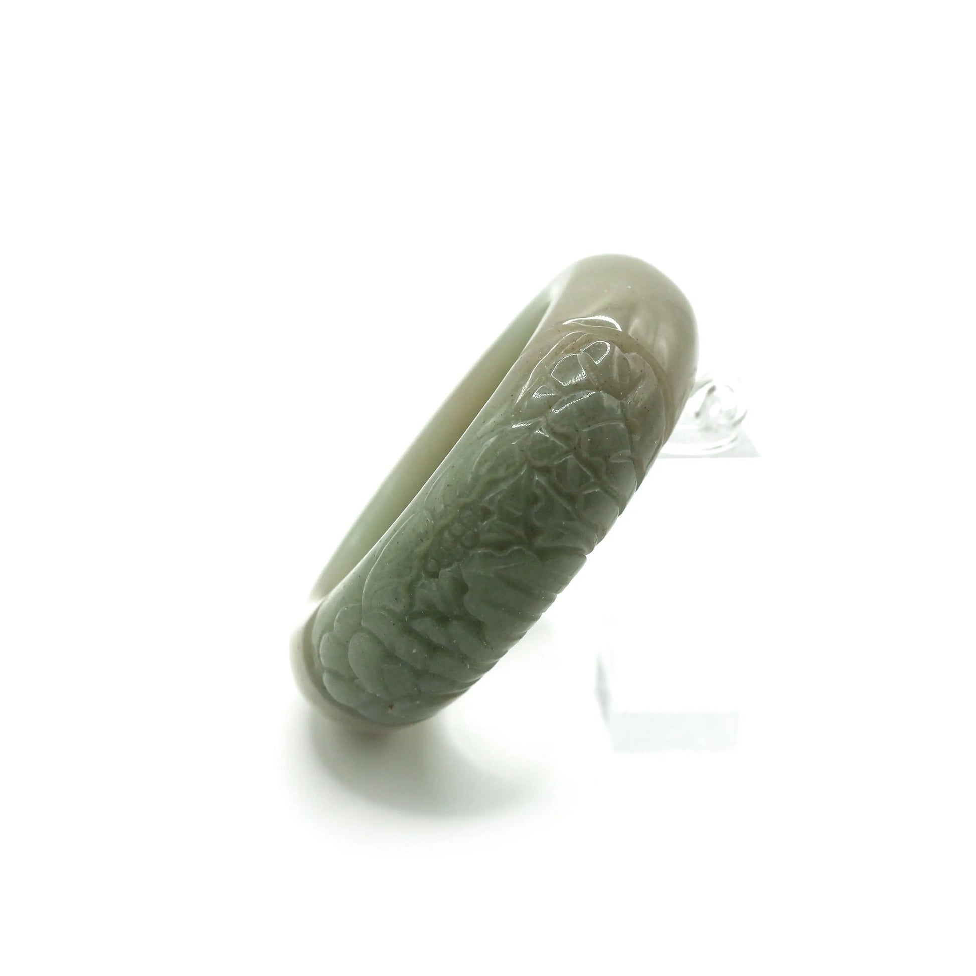 Elegant green jade bangle carved with a single peony flower, showcasing quiet refinement and natural harmony in asymmetry – Miruzi