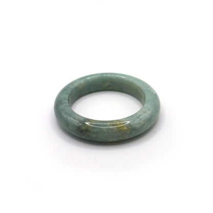 Light blue jade bangle glowing softly under natural daylight Miruzi