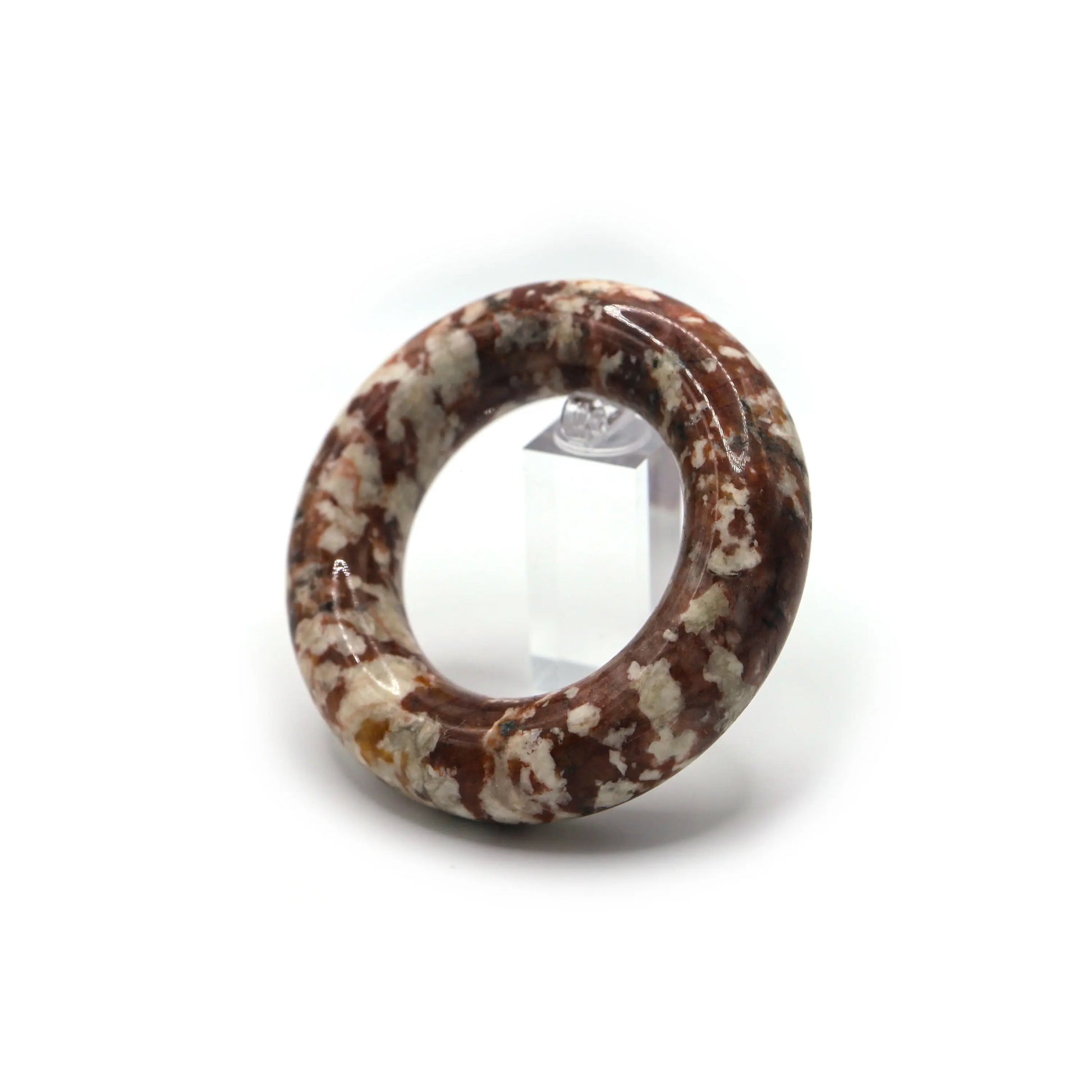 A circular crimson jade bracelet with spontaneous white mineral bloom patterns that offer rich textural depth – Miruzi
