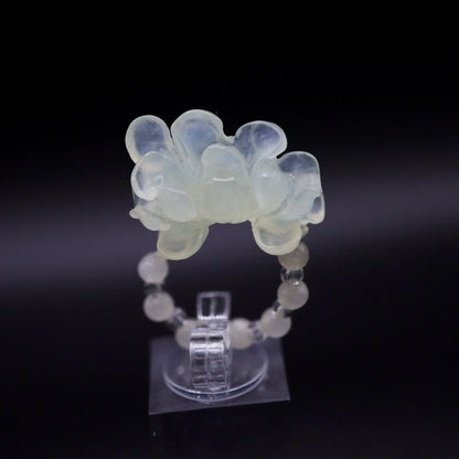 Handcrafted Serene Aqua Peony Adjustable Ring featuring a translucent, ice-clear serpentine base infused with a hint of pale aqua, showcasing a beautifully carved, three-dimensional peony. Perfect for summer, this ring combines ethereal beauty with the art of detailed craftsmanship, ideal for adding a touch of dreamy elegance to any outfit.
