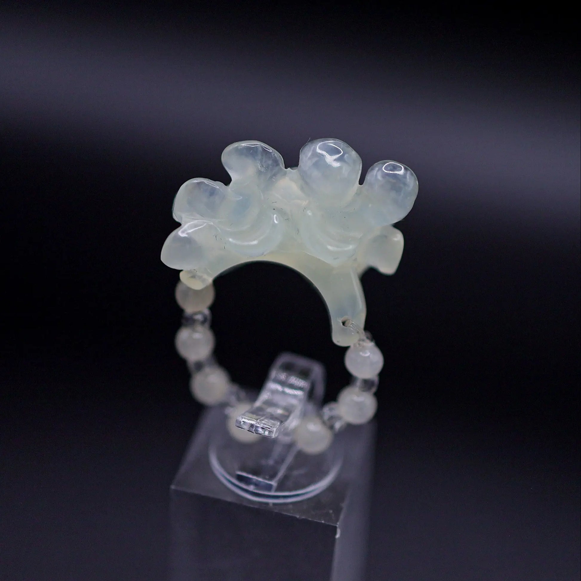 Handcrafted Serene Aqua Peony Adjustable Ring featuring a translucent, ice-clear serpentine base infused with a hint of pale aqua, showcasing a beautifully carved, three-dimensional peony. Perfect for summer, this ring combines ethereal beauty with the art of detailed craftsmanship, ideal for adding a touch of dreamy elegance to any outfit.