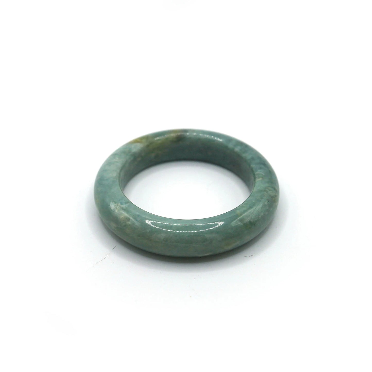 Close-up of misty blue jade bracelet showing cloudy marbling and gentle glow Miruzi