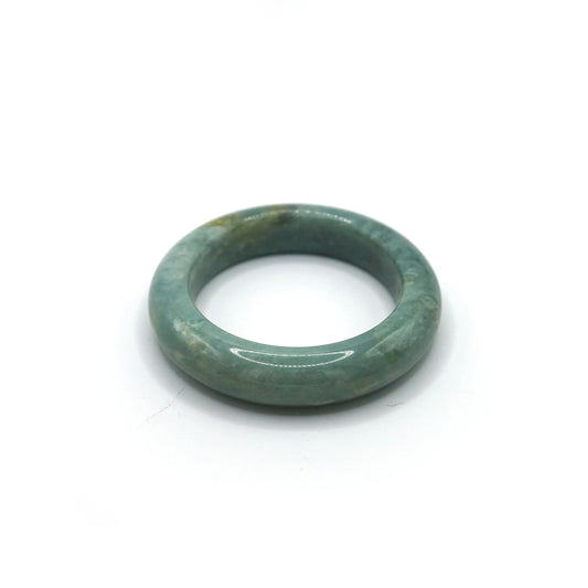 Close-up of misty blue jade bracelet showing cloudy marbling and gentle glow Miruzi