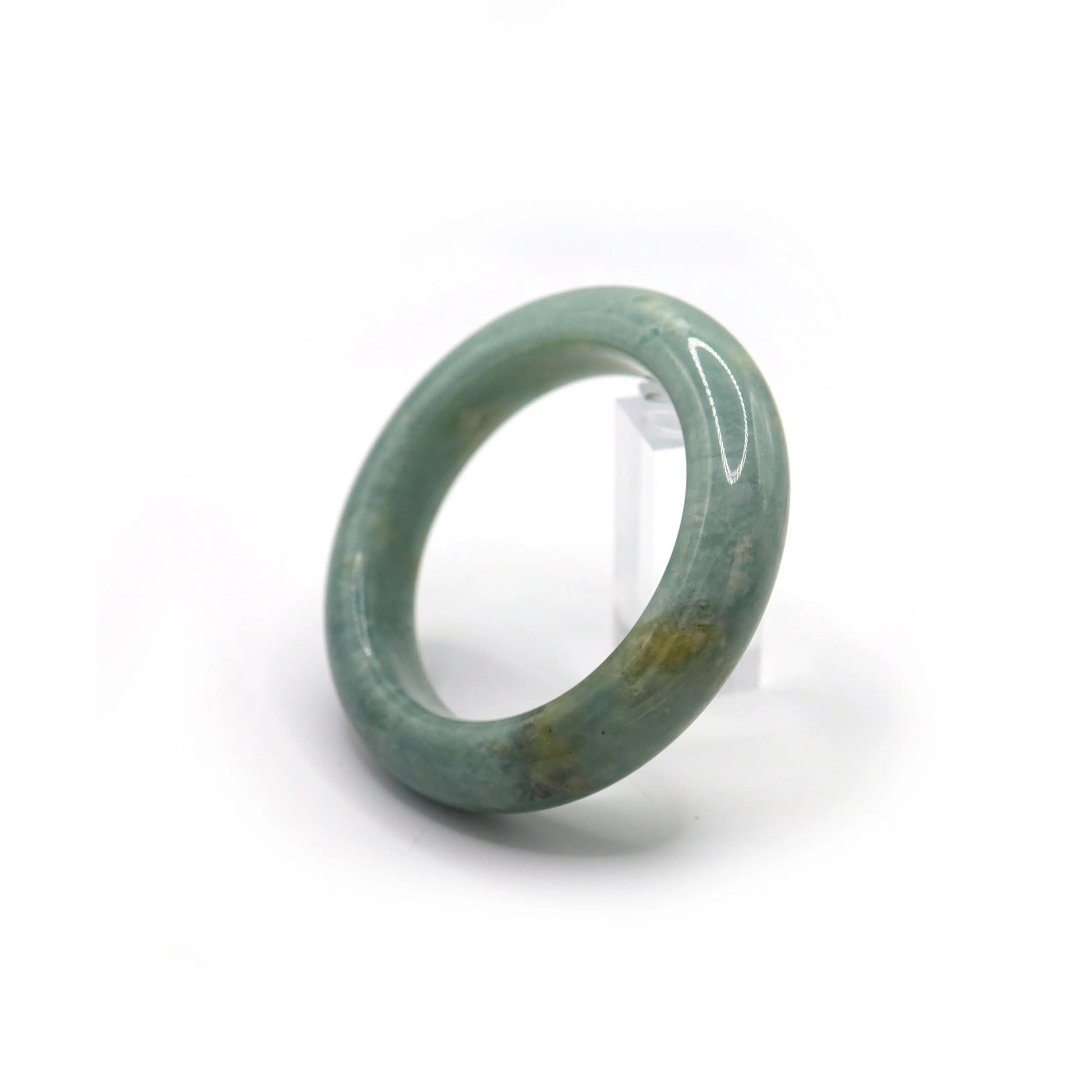 Blue jade bracelet styled with cloudy-toned textiles and powdery neutrals Miruzi