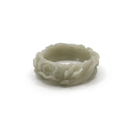 Symbolic jade bracelet in smooth green stone, showcasing delicate hand-carved details of a fox and flower in a poetic composition – Miruzi