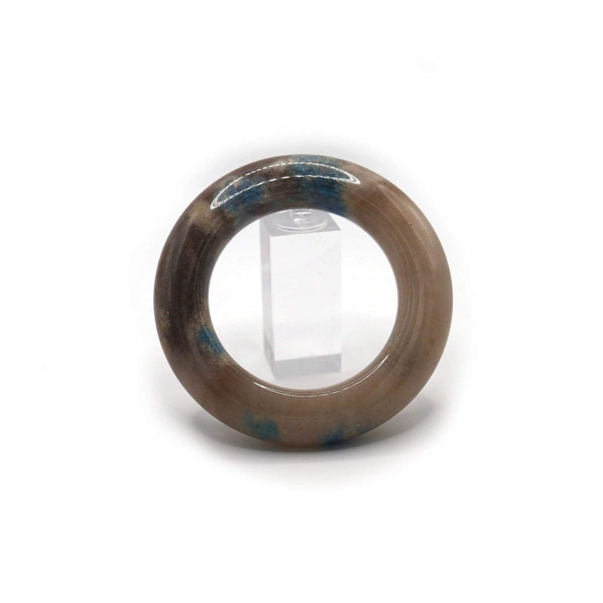 Round jade bangle with creamy white base and abstract lavender and blue mineral inclusions, styled for a light, layered look – Miruzi