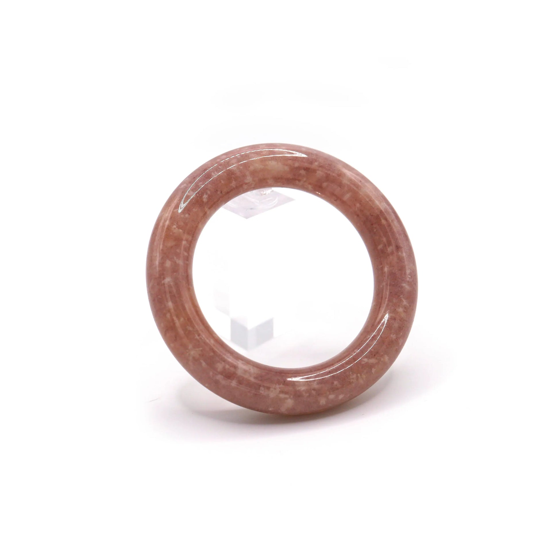 Close-up of pinkish-purple jade bangle with natural white mineral flecks resembling constellations on a twilight-colored stone – Miruzi