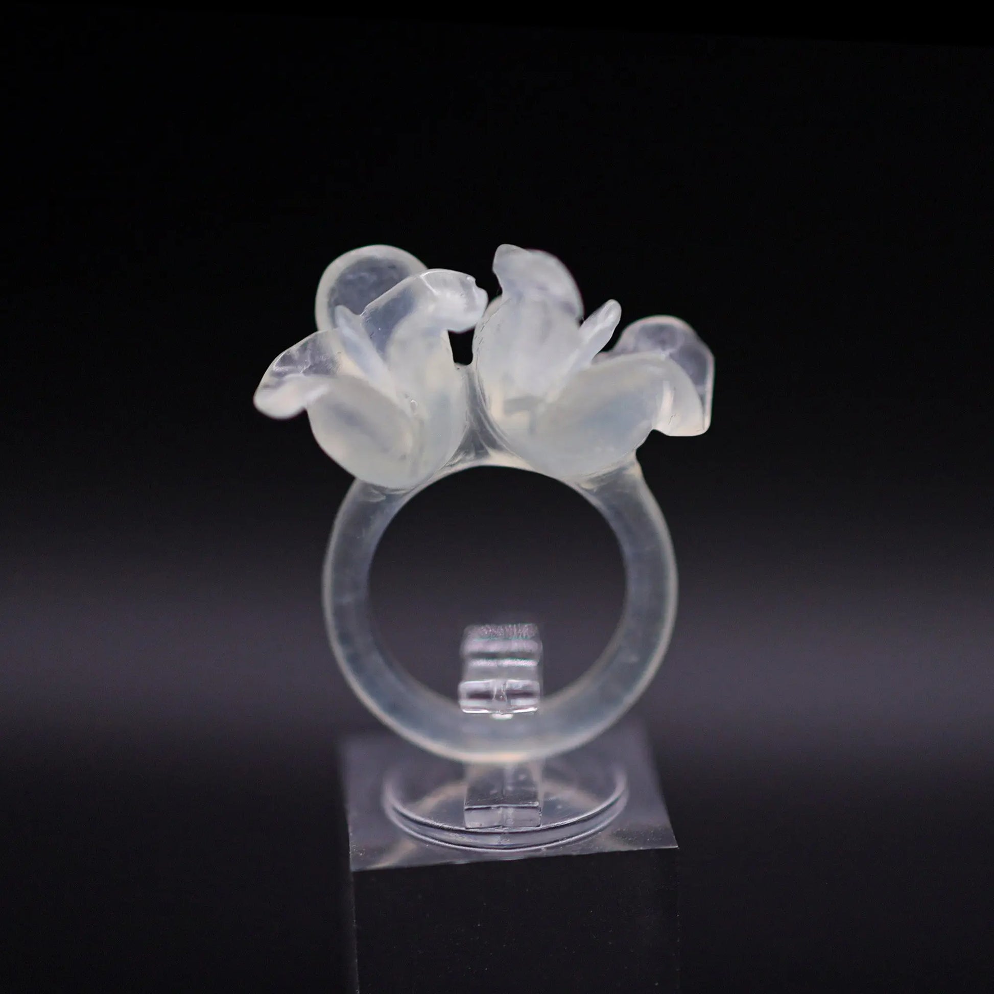Sublime Ice Magnolia Serpentine Ring featuring crystal-clear serpentine intricately carved into three-dimensional magnolia blossoms, symbolizing purity and natural beauty. The icy, translucent base enhances the floral details, making it a perfect blend of artistry and elegance.