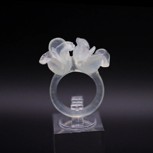 Sublime Ice Magnolia Serpentine Ring featuring crystal-clear serpentine intricately carved into three-dimensional magnolia blossoms, symbolizing purity and natural beauty. The icy, translucent base enhances the floral details, making it a perfect blend of artistry and elegance.