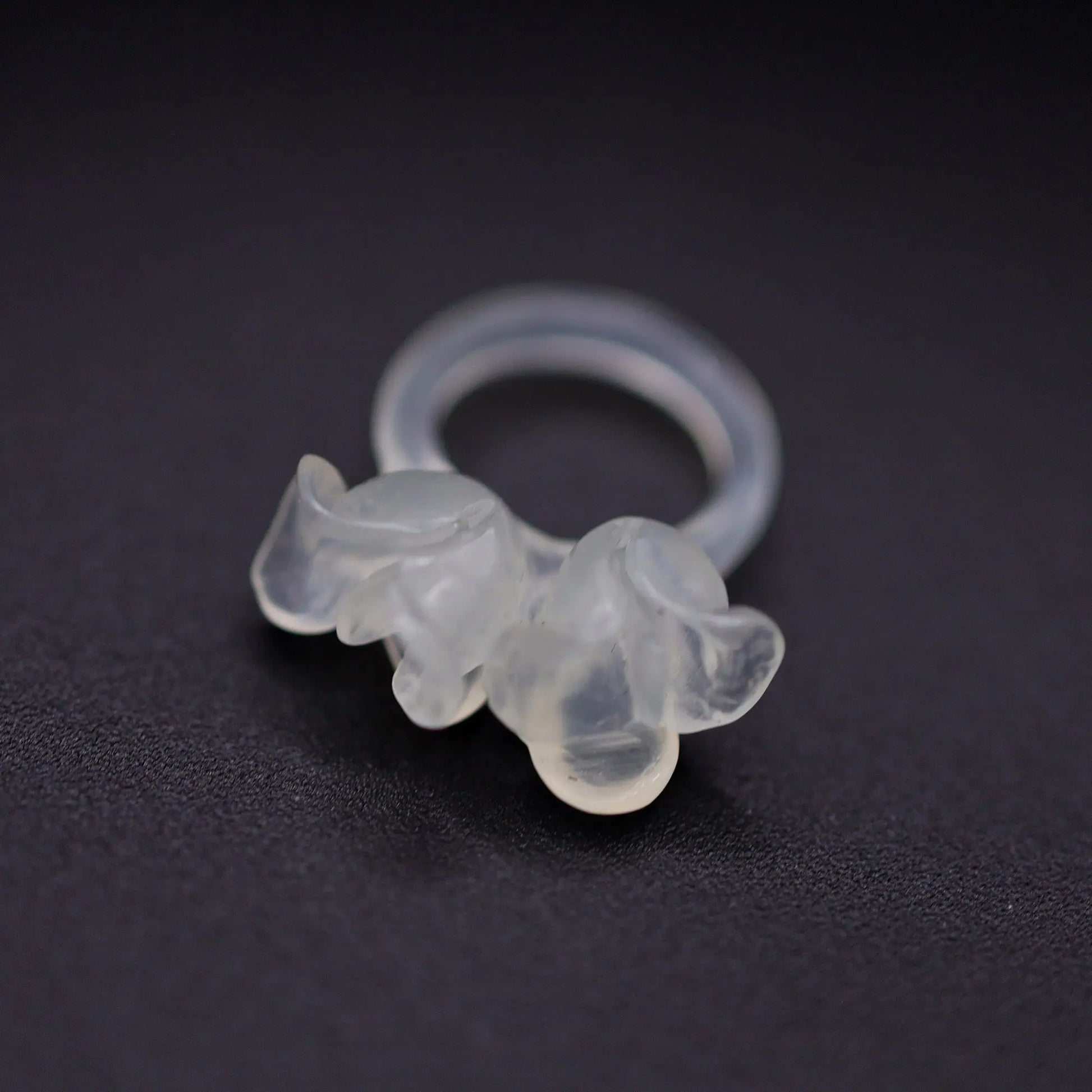 Sublime Ice Magnolia Serpentine Ring featuring crystal-clear serpentine intricately carved into three-dimensional magnolia blossoms, symbolizing purity and natural beauty. The icy, translucent base enhances the floral details, making it a perfect blend of artistry and elegance.