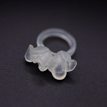 Sublime Ice Magnolia Serpentine Ring featuring crystal-clear serpentine intricately carved into three-dimensional magnolia blossoms, symbolizing purity and natural beauty. The icy, translucent base enhances the floral details, making it a perfect blend of artistry and elegance.