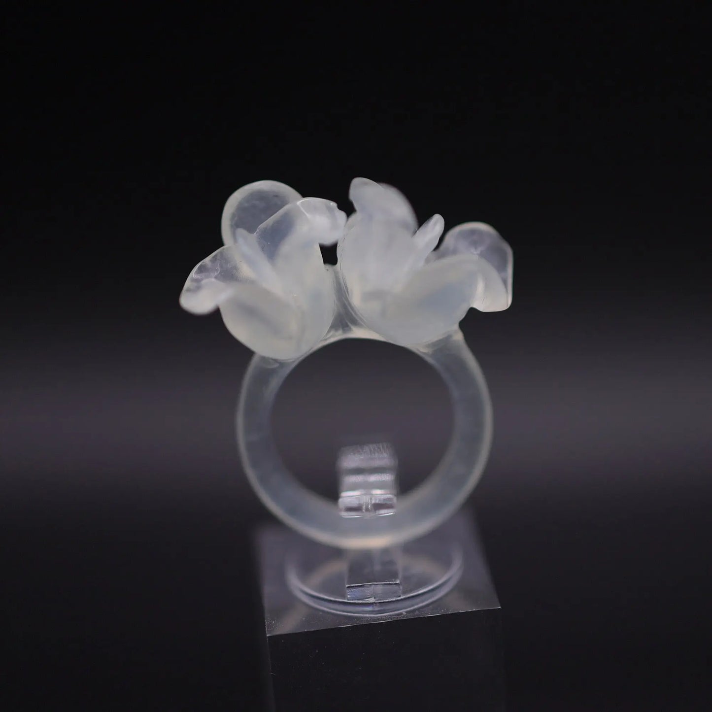 Sublime Ice Magnolia Serpentine Ring featuring crystal-clear serpentine intricately carved into three-dimensional magnolia blossoms, symbolizing purity and natural beauty. The icy, translucent base enhances the floral details, making it a perfect blend of artistry and elegance.