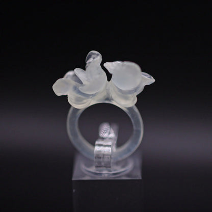 Sublime Ice Magnolia Serpentine Ring featuring crystal-clear serpentine intricately carved into three-dimensional magnolia blossoms, symbolizing purity and natural beauty. The icy, translucent base enhances the floral details, making it a perfect blend of artistry and elegance.