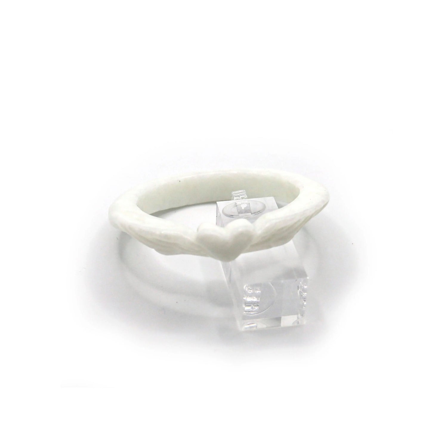 Slim Mongolian white jade bracelet with delicately carved heart at the center and feather designs on each side, glowing with soft translucence – Miruzi