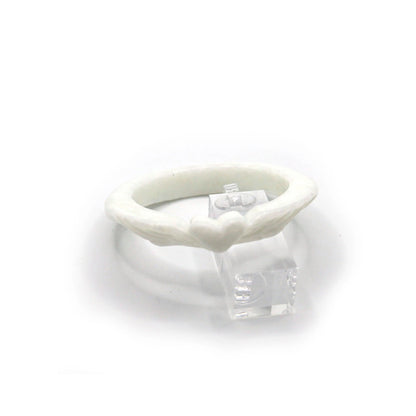 Slim Mongolian white jade bracelet with delicately carved heart at the center and feather designs on each side, glowing with soft translucence – Miruzi