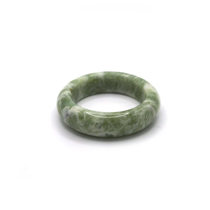 Woman wearing matcha green jade bracelet with pistachio-toned outfit - Miruzi