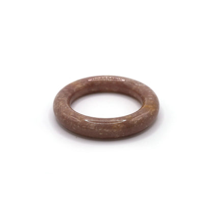 A delicate lavender jade bracelet in a rounded form, with white mineral points evoking the calm of dusk skies – Miruzi