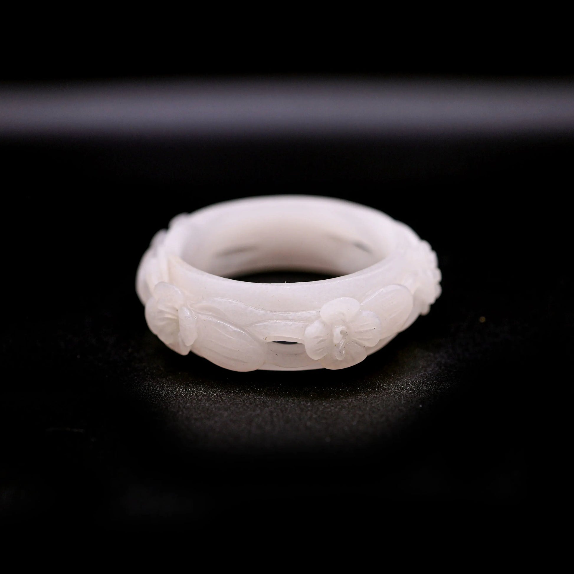 Pure white Mongolian jade bracelet featuring five openwork violet flowers carved in full relief, blending elegance with nature-inspired design – Miruzi