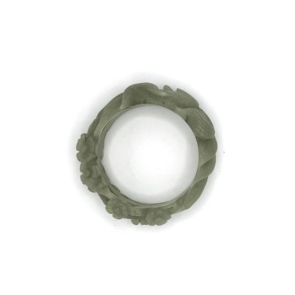 Fox bracelet carved from natural Mongolian jade, featuring a peaceful nine-tailed fox and hollow plum blossom design symbolizing serenity and resilience. - Miruzi