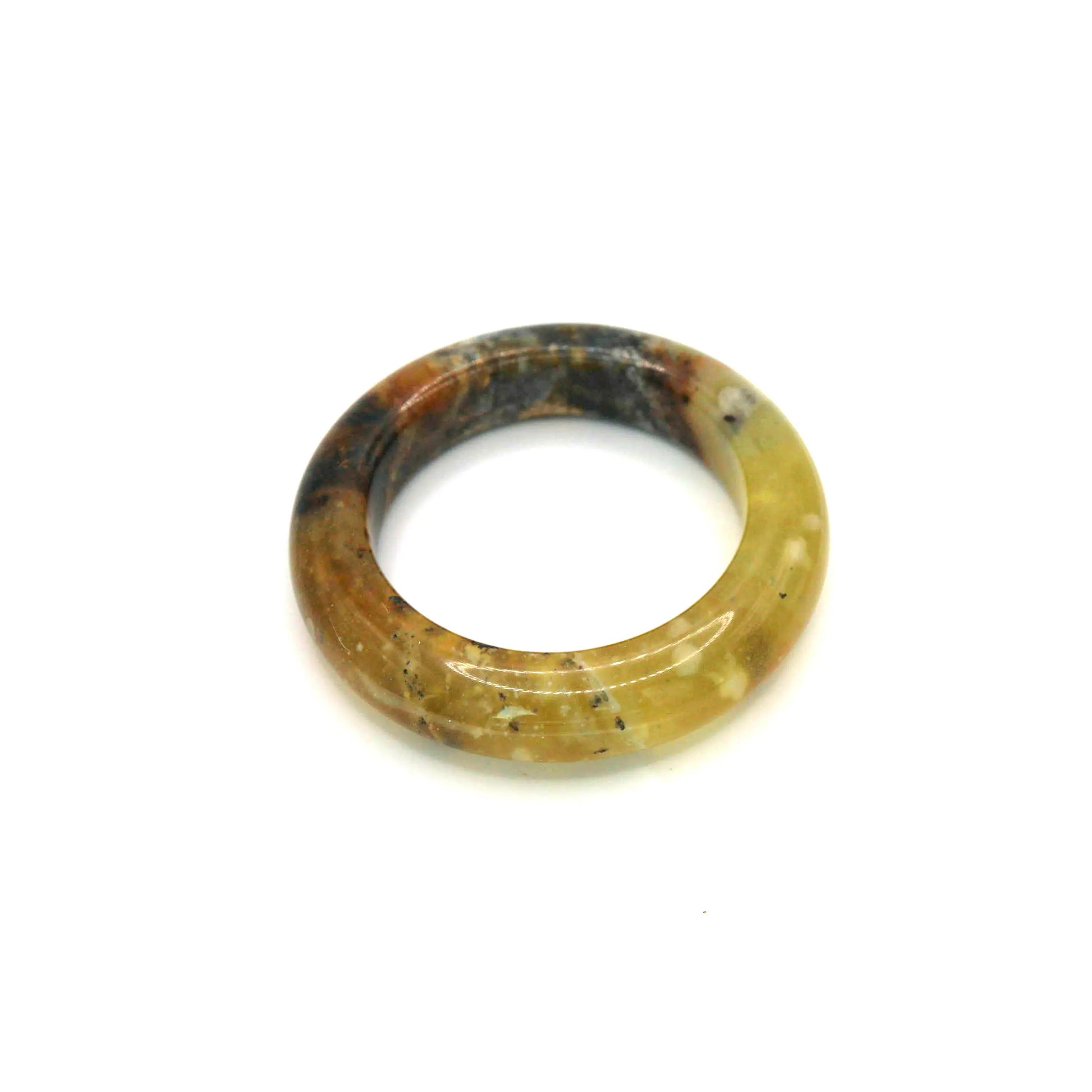 High-contrast yellow jade bangle with radiant translucence and matte mineral texture in one sculptural form

