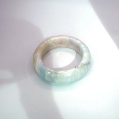Dreamy pastel jade bracelet with natural color diffusion and luminous, semi-transparent finish


